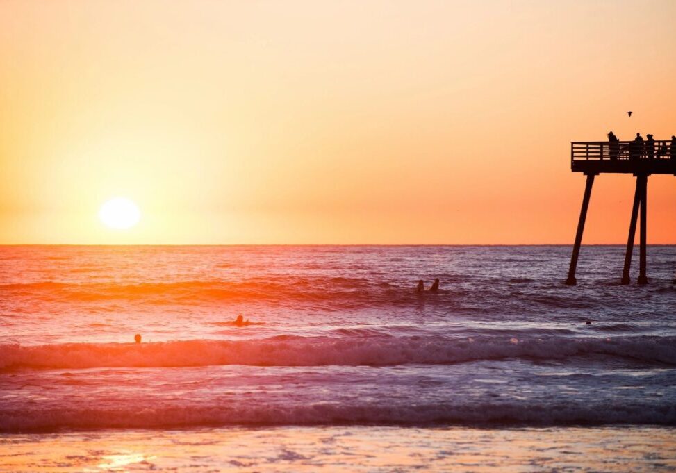 A person riding a surf board on top of water